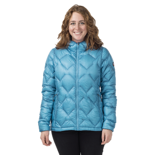 Woman in geometric patterned blue puffer jacket