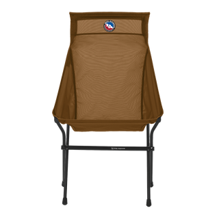 The Big Agnes Big Six Camp Chair features a brown, tall back with a mesh fabric seat and black metal frame, viewed from the front. A circular logo appears near the top of the backrest.