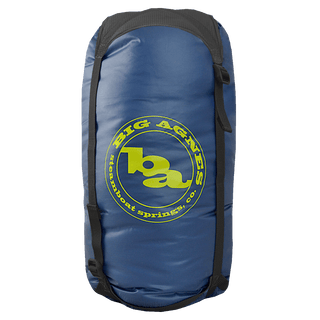 The Superlight Girdle by Big Agnes is a blue cylindrical stuff sack with black straps, ideal for gear storage, and features the yellow Big Agnes Steamboat Springs, CO logo on the side.