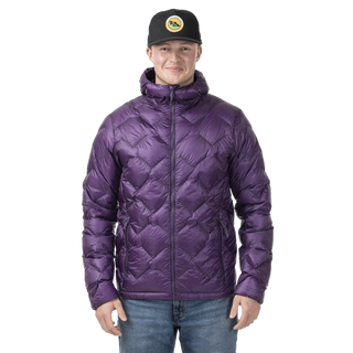 Man standing in a purple quilted puffer jacket